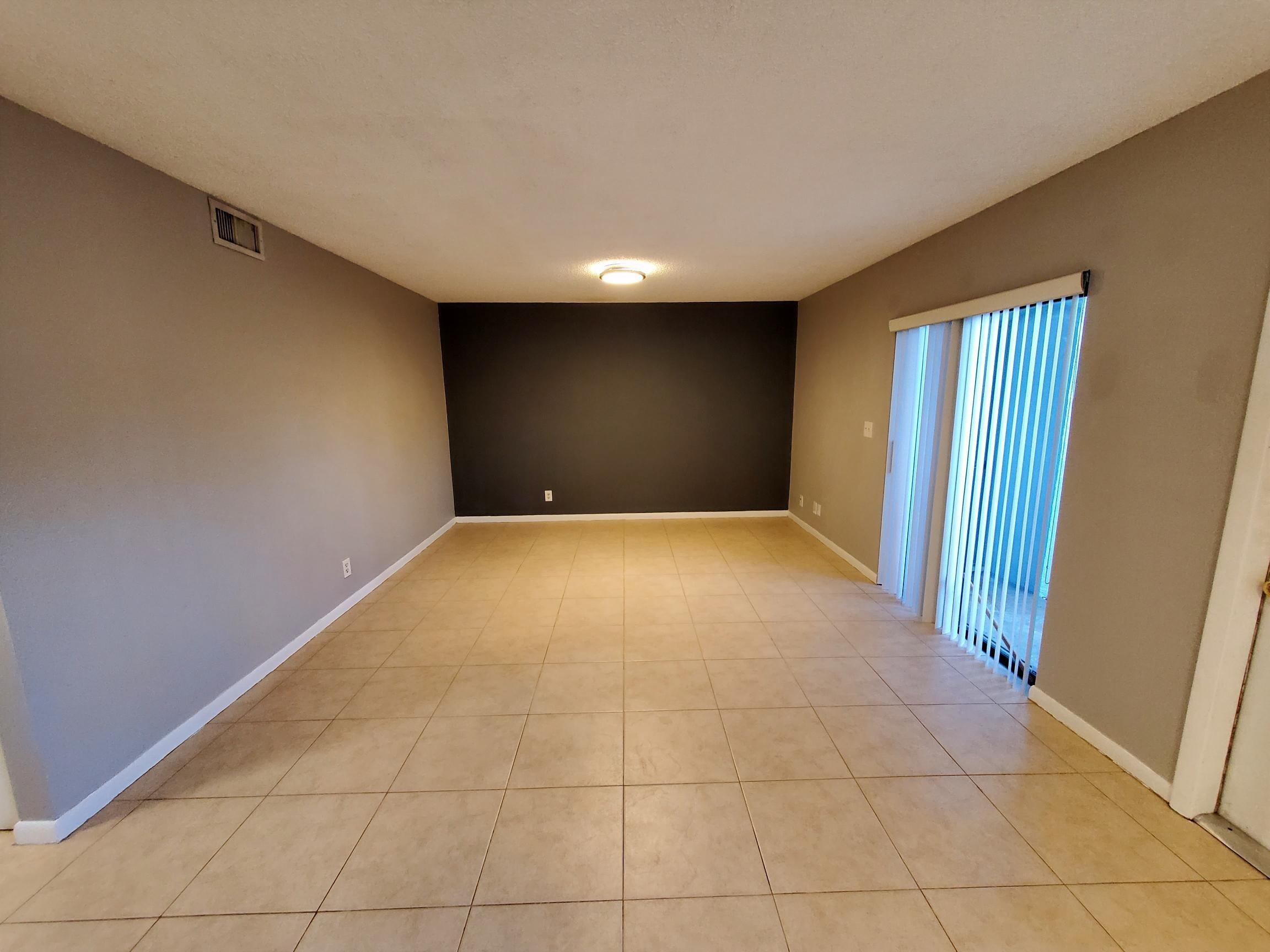 2445 Southwest 22nd Avenue, Unit 1020 Delray Beach, FL 33445 - Photo 20 of 37 a view of a livingroom with a staircase