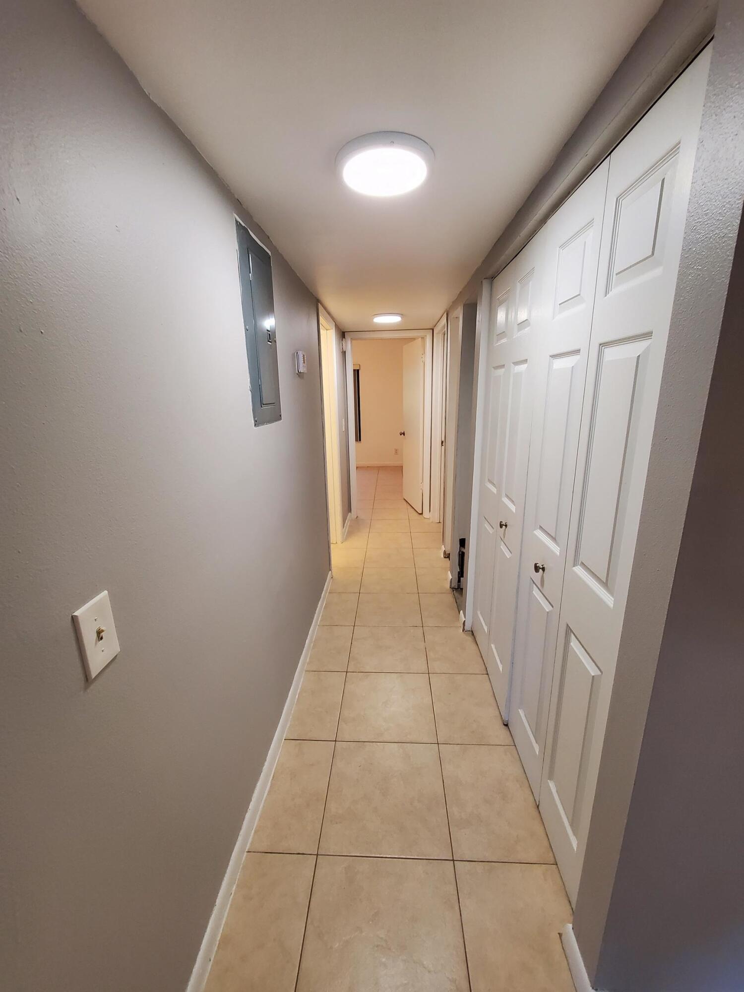 2445 Southwest 22nd Avenue, Unit 1020 Delray Beach, FL 33445 - Photo 22 of 37 a view of a hallway