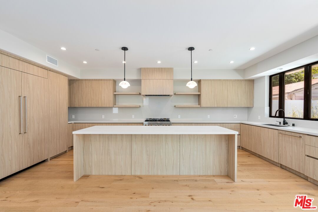 4647 Morse Avenue Sherman Oaks, CA 91423 - Photo 11 of 47 a large kitchen with stainless steel appliances lots of counter space