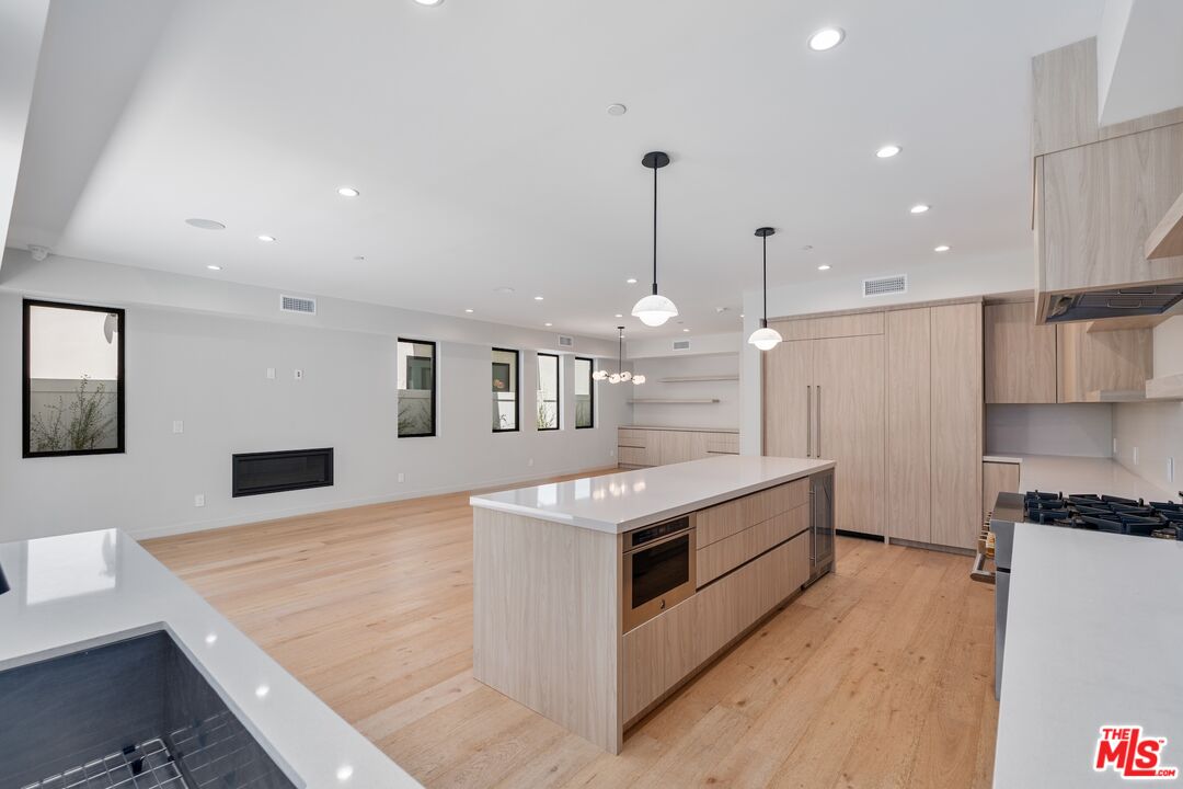 4647 Morse Avenue Sherman Oaks, CA 91423 - Photo 14 of 47 a large kitchen with stainless steel appliances granite countertop a large counter top and a stove