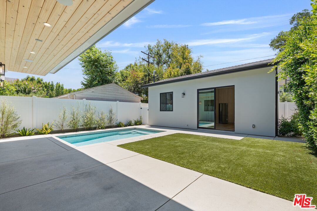 4647 Morse Avenue Sherman Oaks, CA 91423 - Photo 16 of 47 a view of a backyard with potted plants and a tree