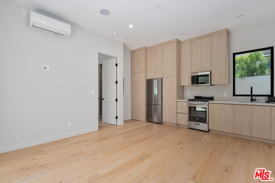4647 Morse Avenue Sherman Oaks, CA 91423 - Photo 20 of 47 a kitchen with stainless steel appliances a refrigerator and a stove top oven