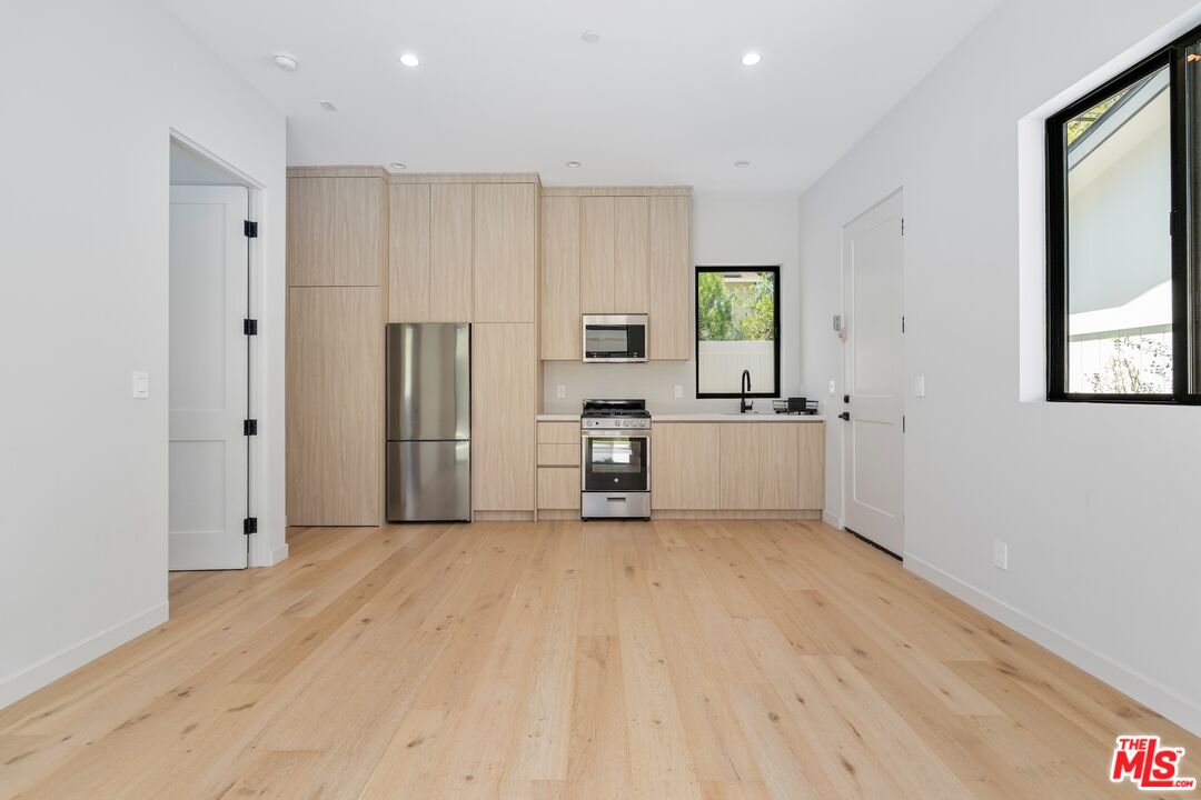 4647 Morse Avenue Sherman Oaks, CA 91423 - Photo 22 of 47 a view of a kitchen with a sink and a window