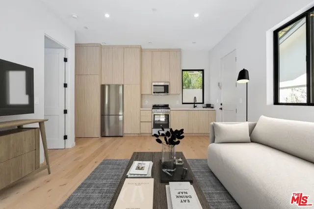 a living room with furniture and a rug