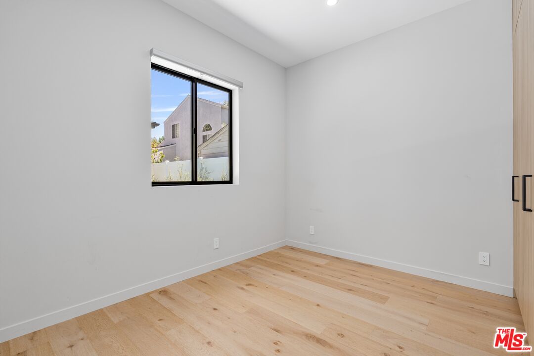 4647 Morse Avenue Sherman Oaks, CA 91423 - Photo 24 of 47 a view of a small space with wooden floor and a window