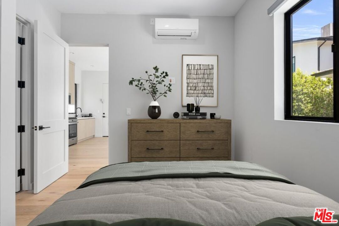 4647 Morse Avenue Sherman Oaks, CA 91423 - Photo 26 of 47 a bedroom with a bed and a window