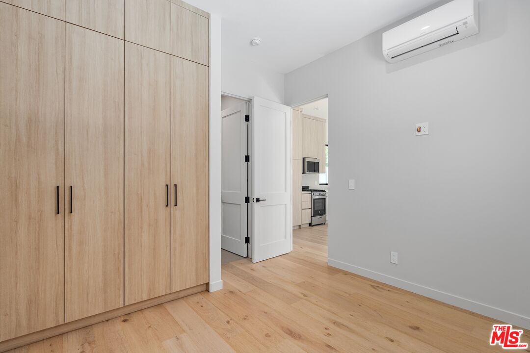 4647 Morse Avenue Sherman Oaks, CA 91423 - Photo 27 of 47 a view of a hallway with wooden floor