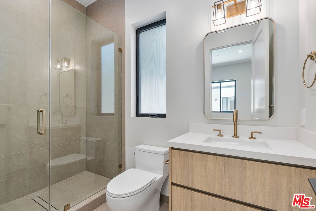 4647 Morse Avenue Sherman Oaks, CA 91423 - Photo 29 of 47 a bathroom with a sink a toilet and shower
