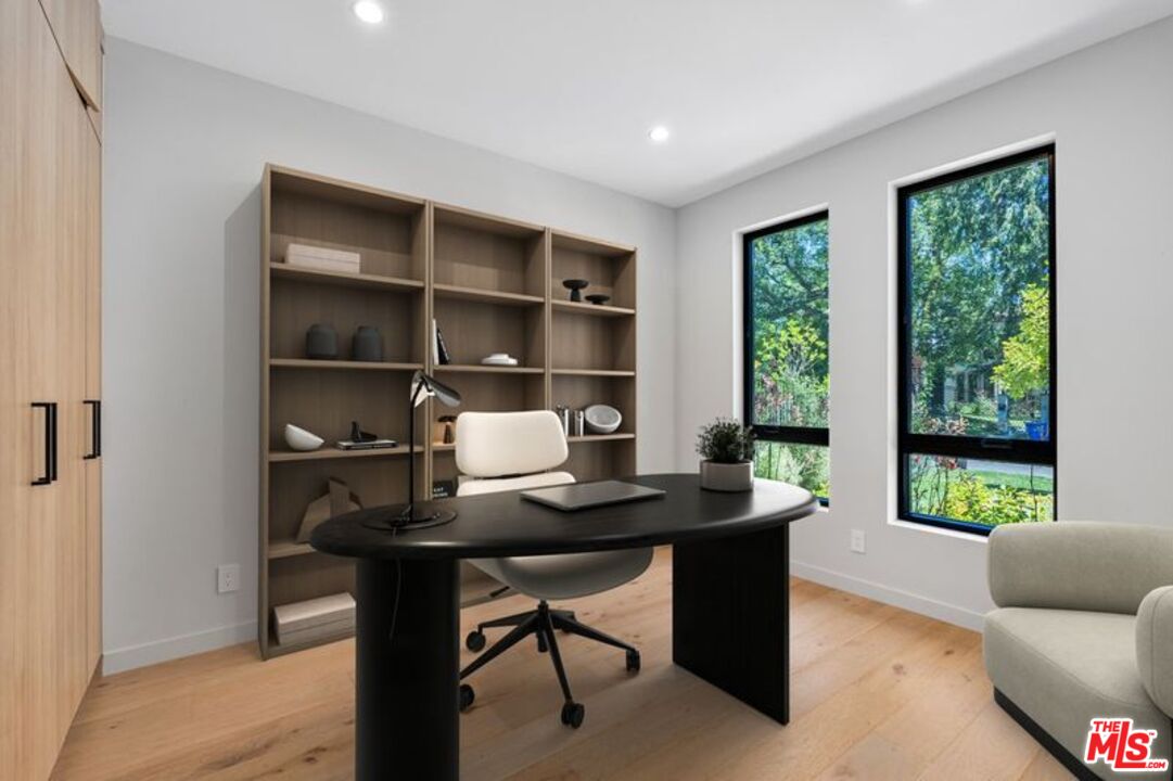 4647 Morse Avenue Sherman Oaks, CA 91423 - Photo 3 of 47 a work room with furniture and a window