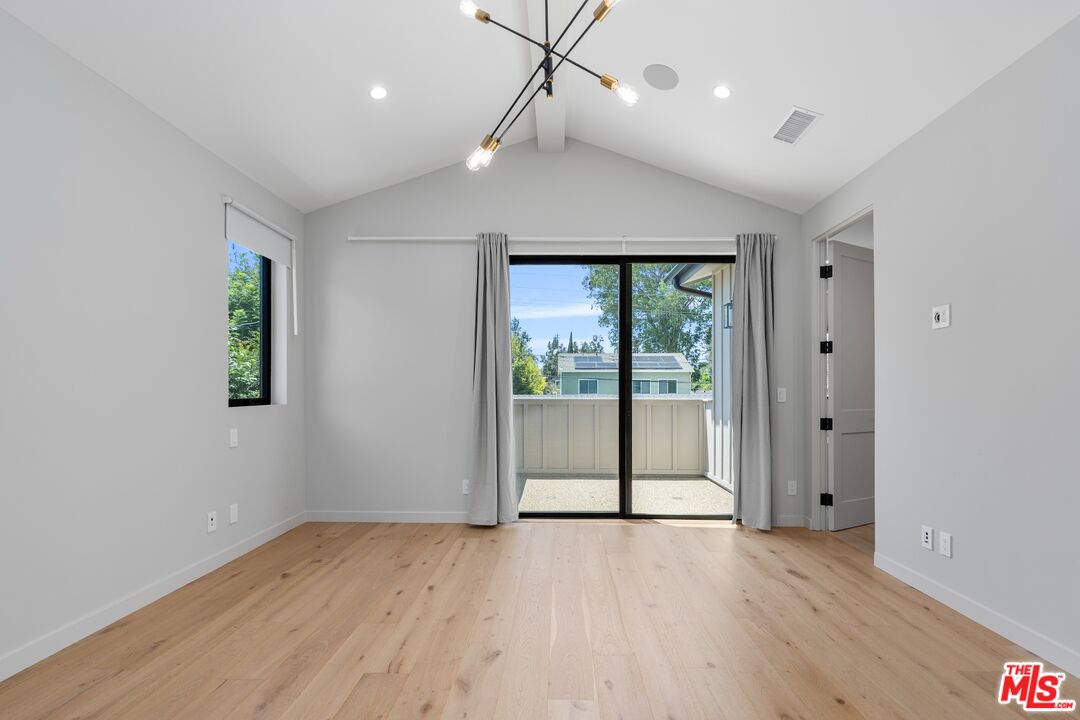 4647 Morse Avenue Sherman Oaks, CA 91423 - Photo 31 of 47 a view of an empty room with wooden floor and a window