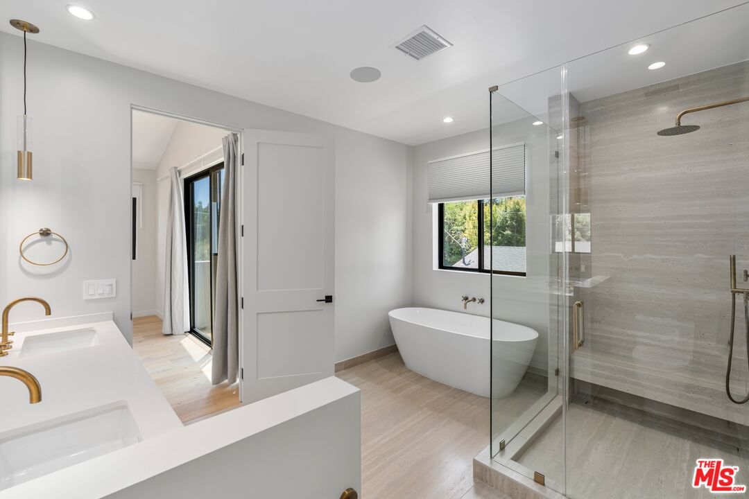4647 Morse Avenue Sherman Oaks, CA 91423 - Photo 38 of 47 a bathroom with a sink a toilet and shower