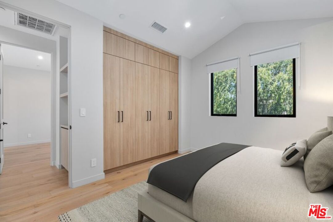 4647 Morse Avenue Sherman Oaks, CA 91423 - Photo 41 of 47 a bedroom with a bed and a window