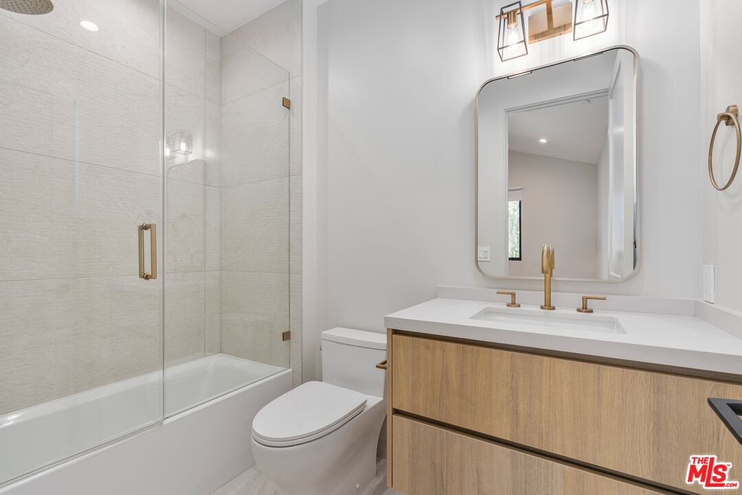 4647 Morse Avenue Sherman Oaks, CA 91423 - Photo 43 of 47 a bathroom with a sink a toilet and shower