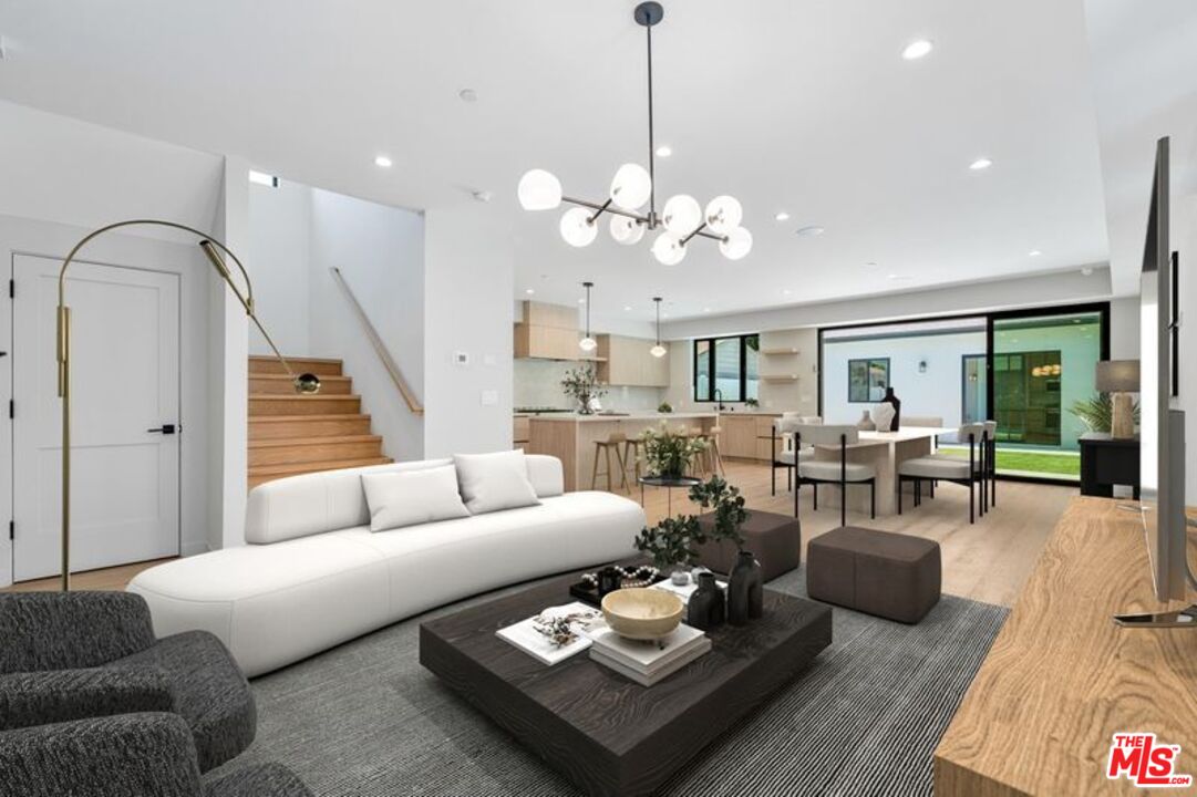 4647 Morse Avenue Sherman Oaks, CA 91423 - Photo 8 of 47 a living room with furniture potted plant and a chandelier
