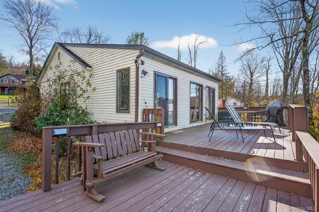 a bedroom with a bed and a view of bedroom