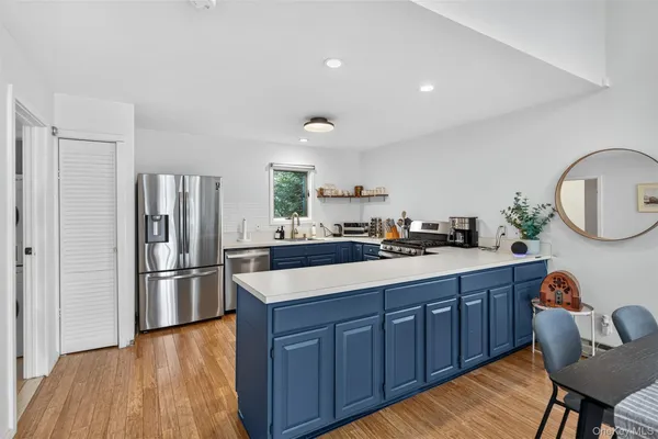 a kitchen with sink and refrigerator