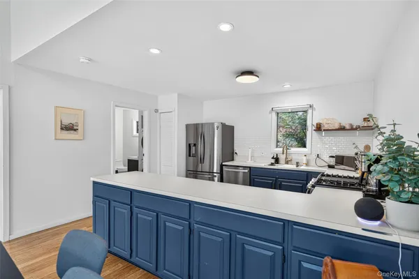 a kitchen with granite countertop a sink and a stove