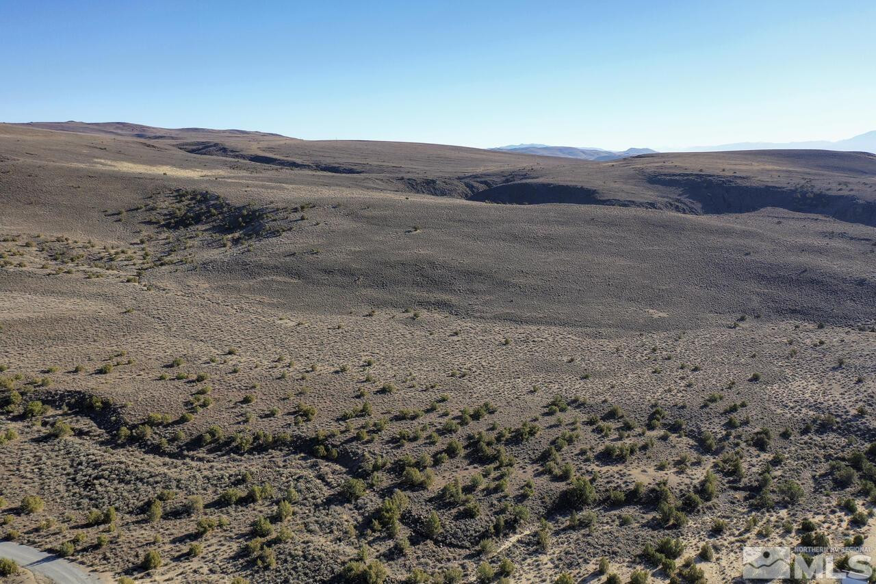 0 Rio Seco Lane Sparks, NV 89441 - Photo 2 of 14 a view of a dry field with mountains in the background