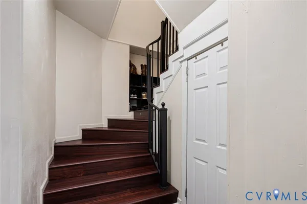 a view of hallway with wooden floor