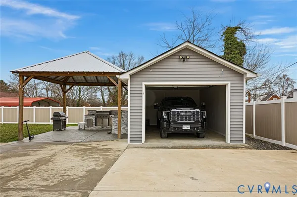 a view of a white house and a yard