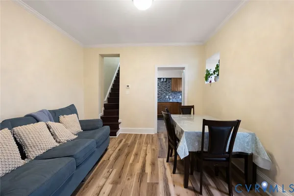 a kitchen with stainless steel appliances a sink stove and cabinets