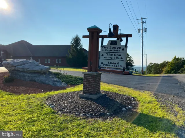 a view of a street with a building in the background