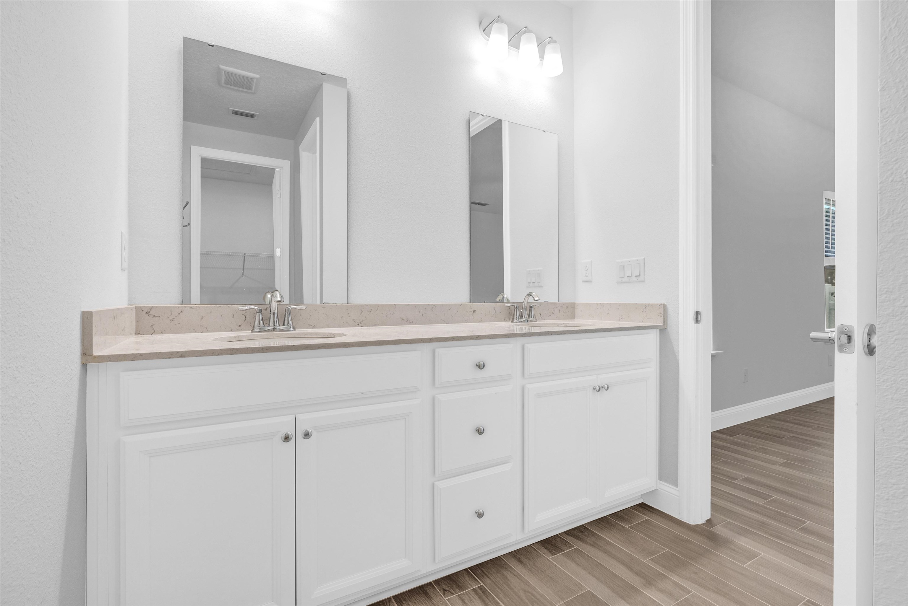 75 Pine Candle Way St. Augustine, FL 32092 - Photo 14 of 84 a bathroom with a sink and a mirror