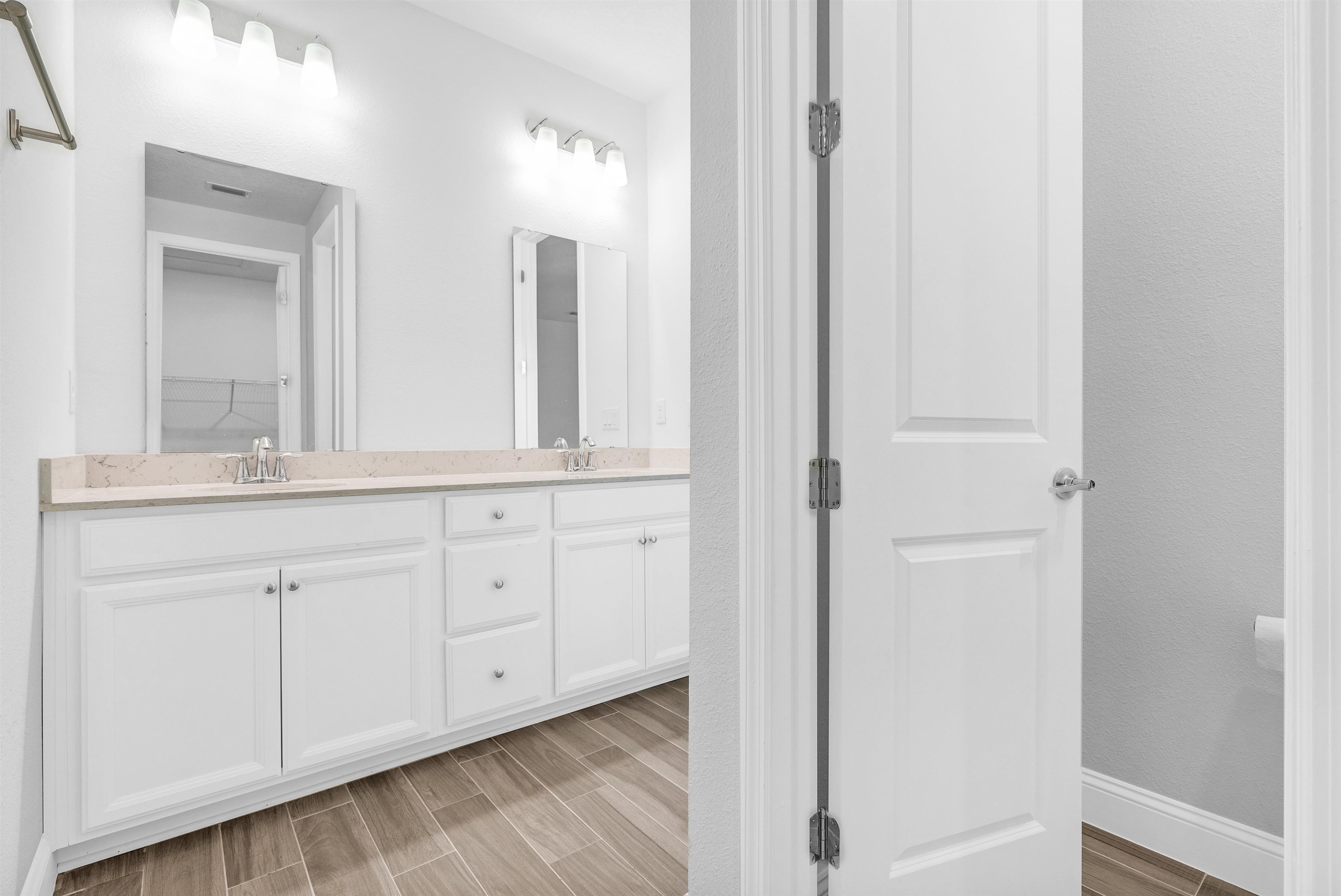 75 Pine Candle Way St. Augustine, FL 32092 - Photo 15 of 84 a bathroom with white cabinets and a sink