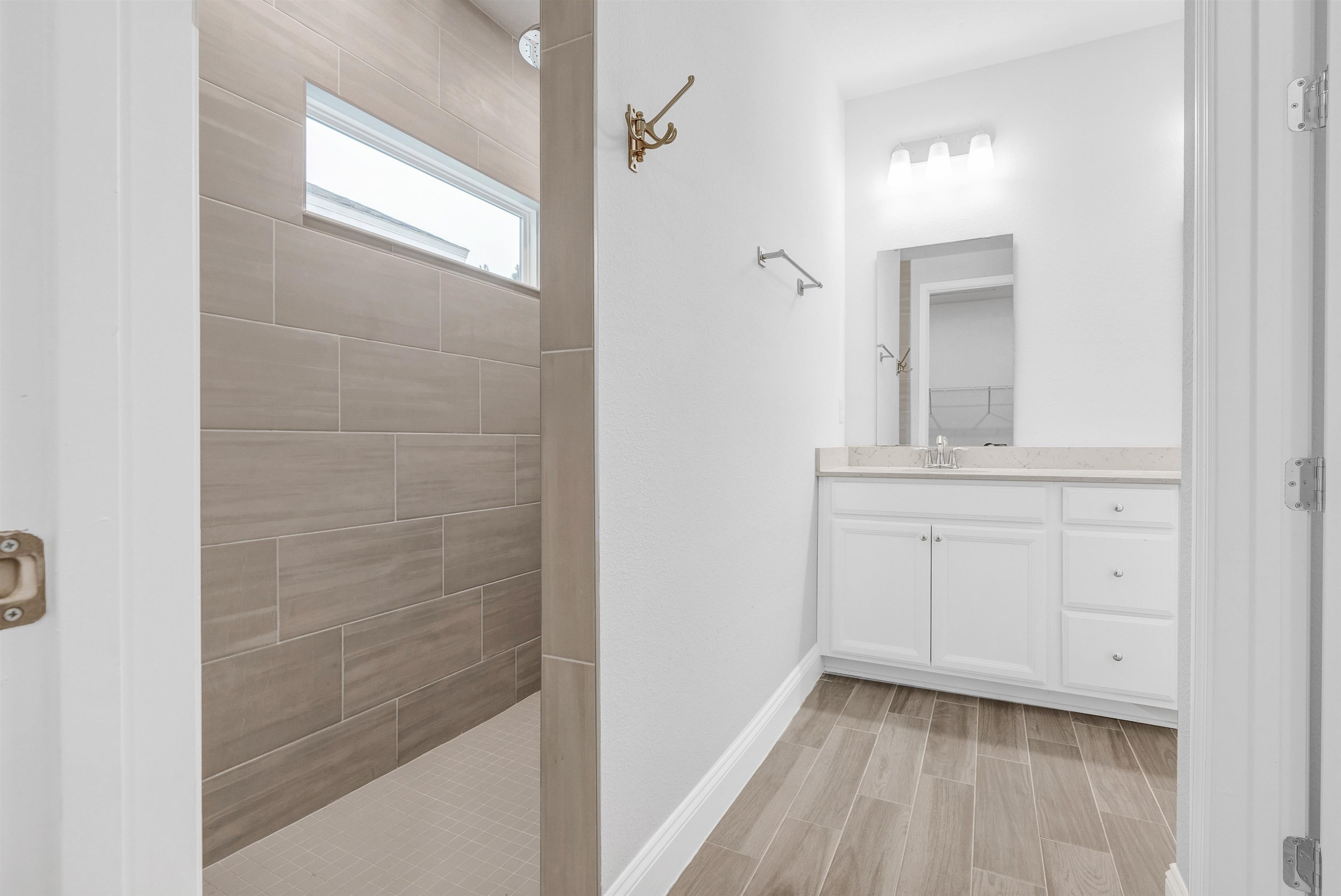 75 Pine Candle Way St. Augustine, FL 32092 - Photo 16 of 84 a bathroom with a sink a vanity and a mirror
