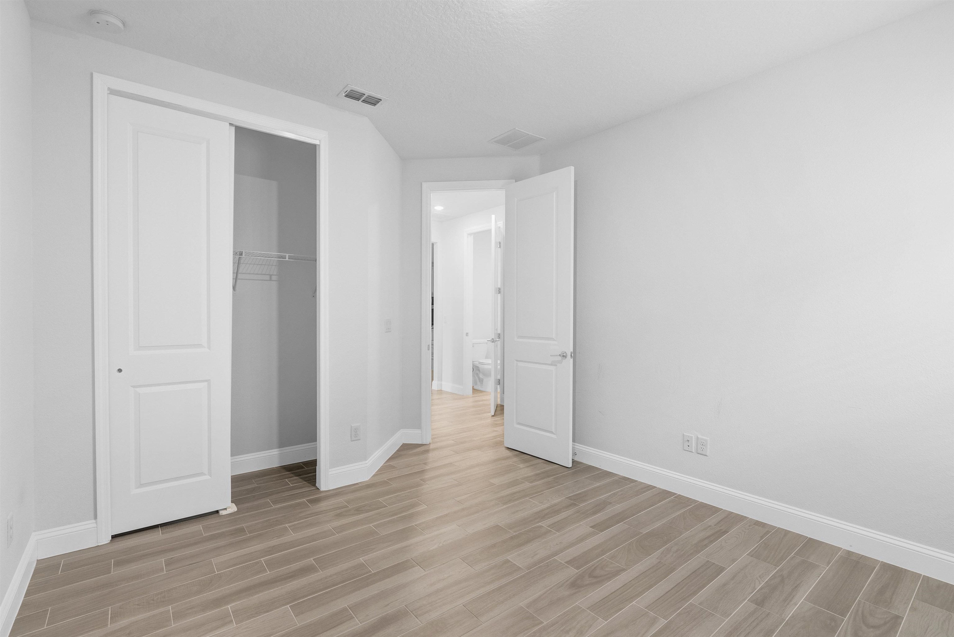 75 Pine Candle Way St. Augustine, FL 32092 - Photo 28 of 84 a view of an empty room with wooden floor