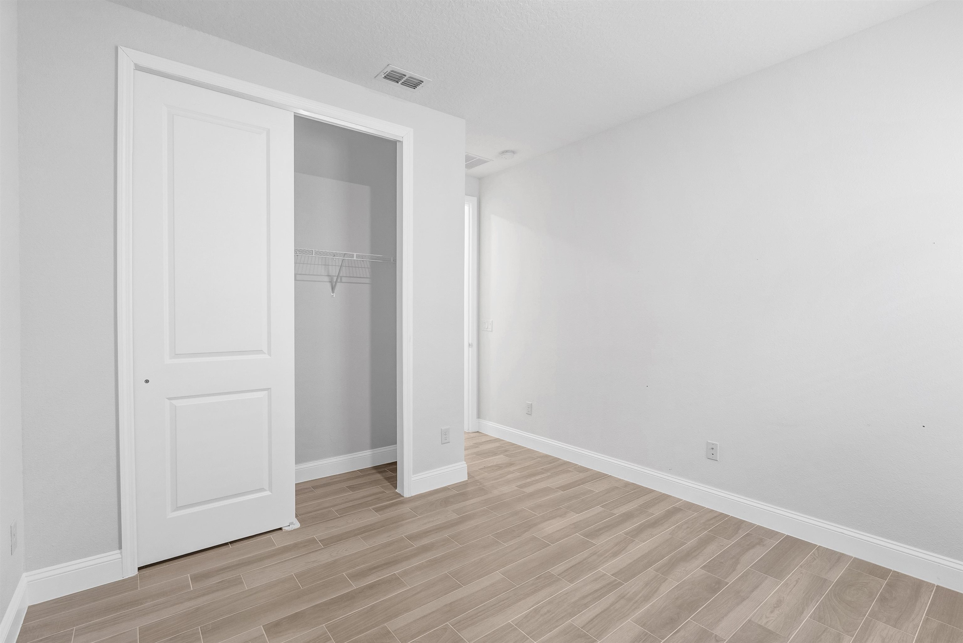 75 Pine Candle Way St. Augustine, FL 32092 - Photo 30 of 84 a view of an empty room with wooden floor