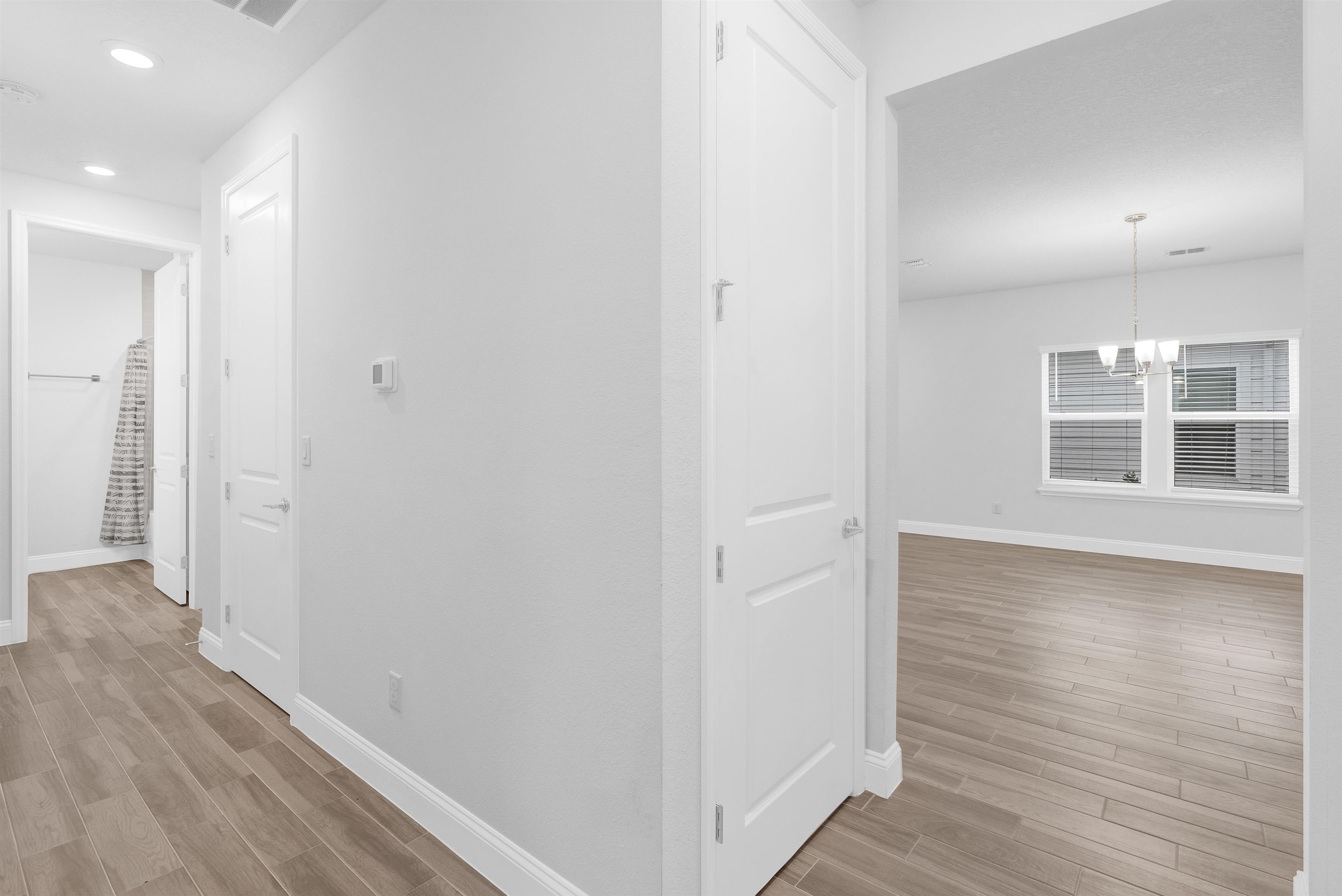 75 Pine Candle Way St. Augustine, FL 32092 - Photo 35 of 84 a view of a hallway with wooden floor and windows