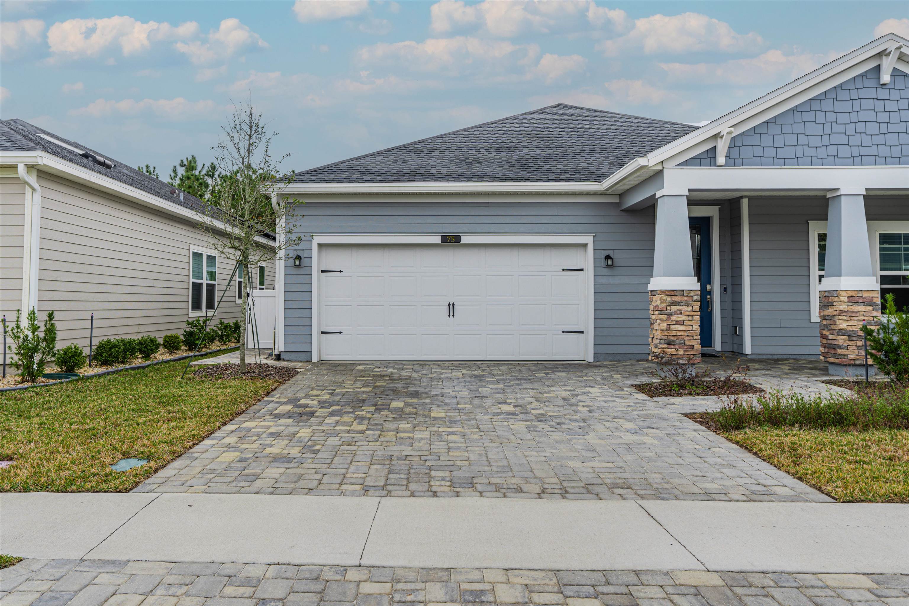 75 Pine Candle Way St. Augustine, FL 32092 - Photo 39 of 84 a front view of a house with garden