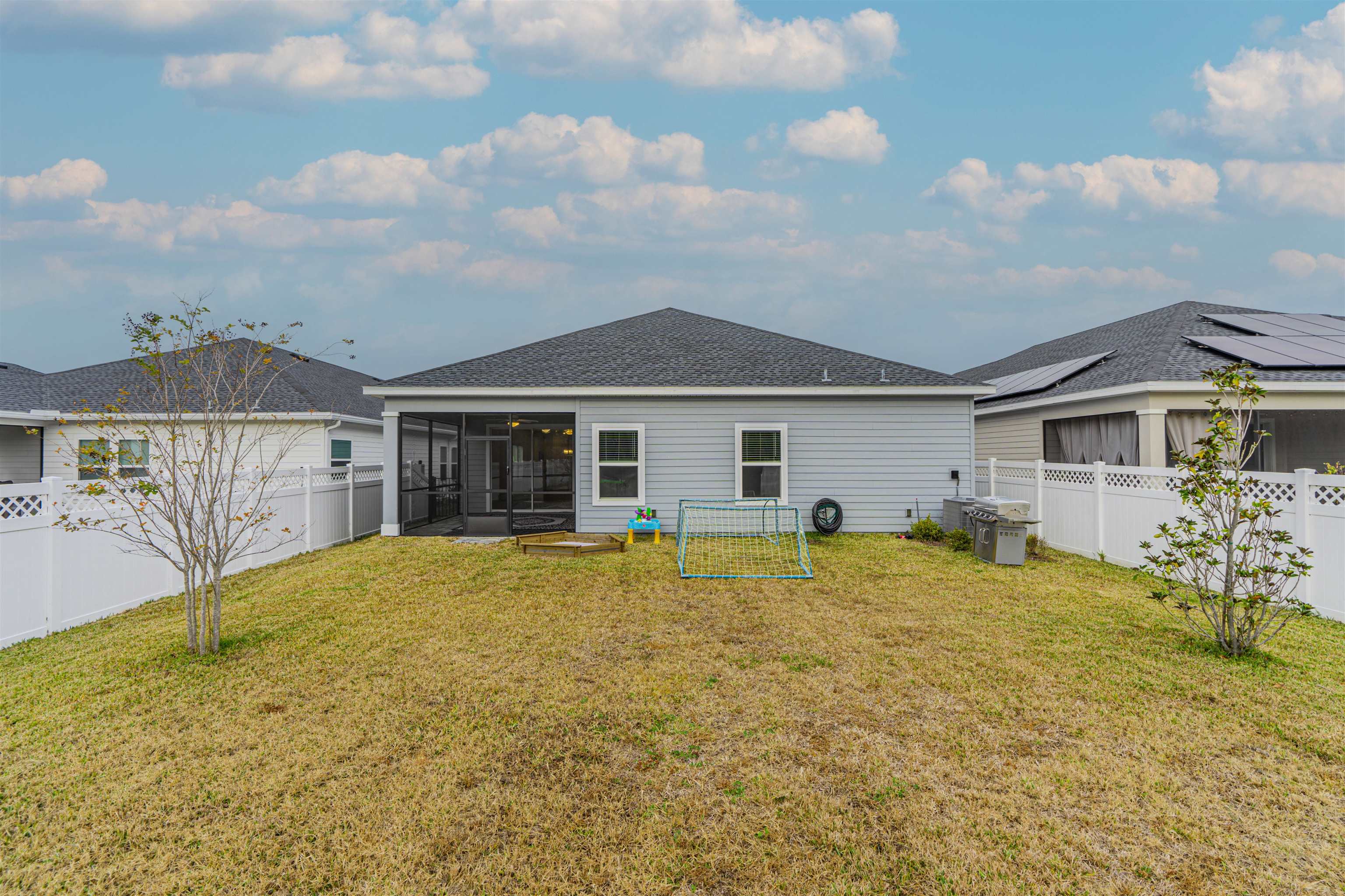 75 Pine Candle Way St. Augustine, FL 32092 - Photo 45 of 84 a front view of a house with a garden