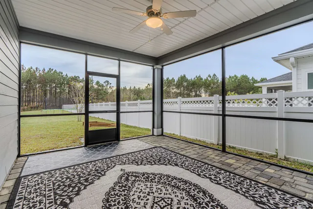 a front view of small building with outdoor space and seating area