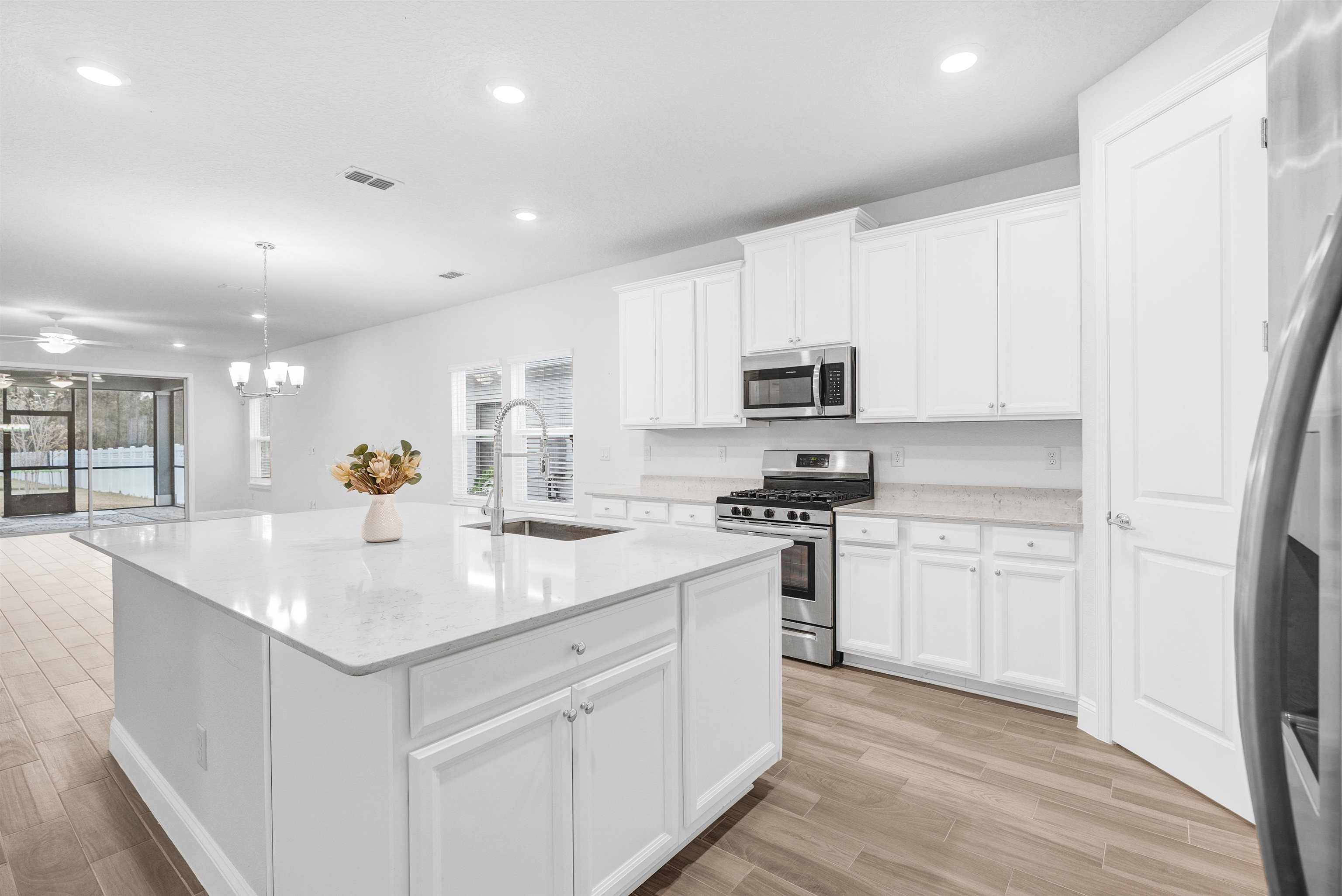 75 Pine Candle Way St. Augustine, FL 32092 - Photo 6 of 84 a kitchen with stainless steel appliances granite countertop a sink stove and refrigerator