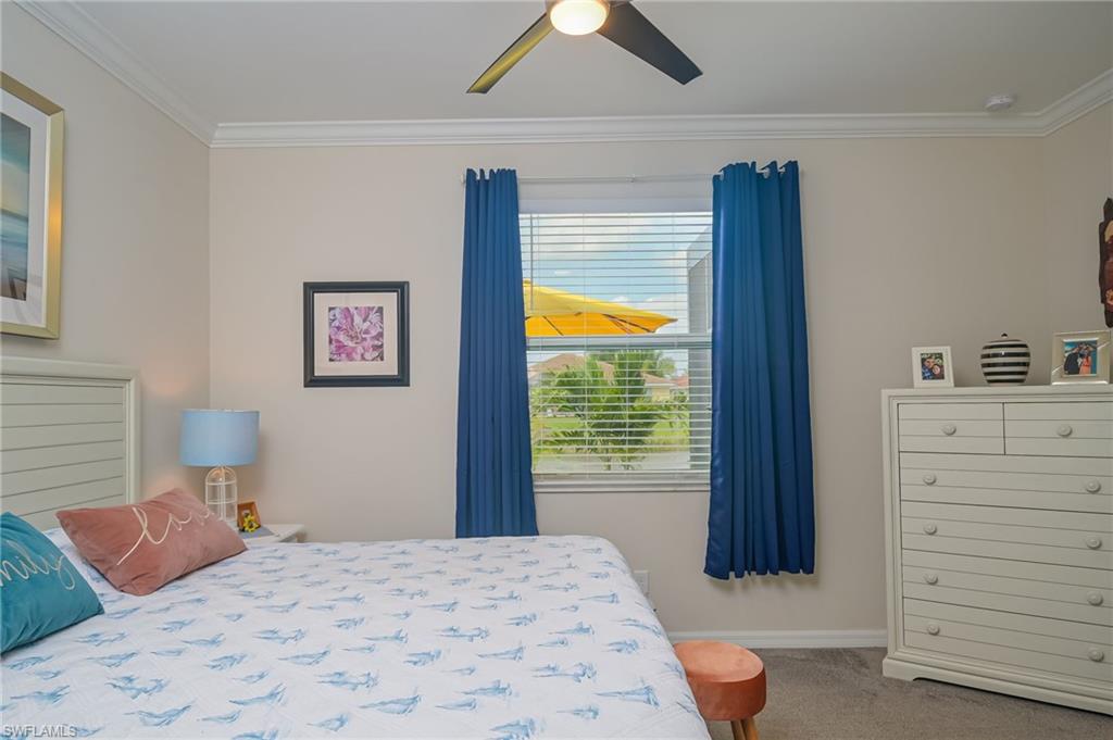 1803 Alameda Drive Naples, FL 34120 - Photo 11 of 30 a bedroom with a bed and a dresser