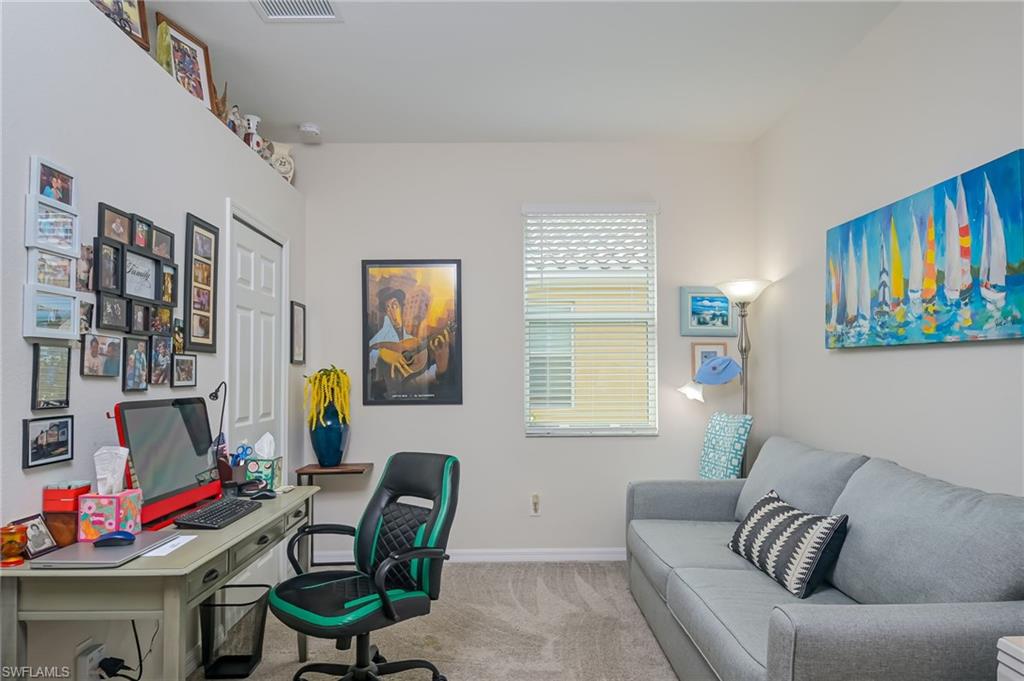 1803 Alameda Drive Naples, FL 34120 - Photo 13 of 30 a living room with furniture and a window