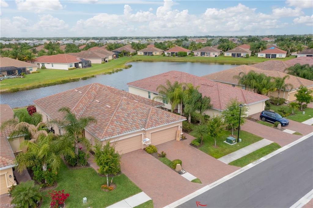 1803 Alameda Drive Naples, FL 34120 - Photo 2 of 30 an aerial view of a city with lots of residential buildings ocean and mountain view in back