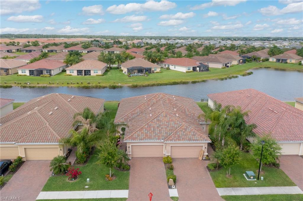 1803 Alameda Drive Naples, FL 34120 - Photo 21 of 30 an aerial view of residential houses with outdoor space and lake view