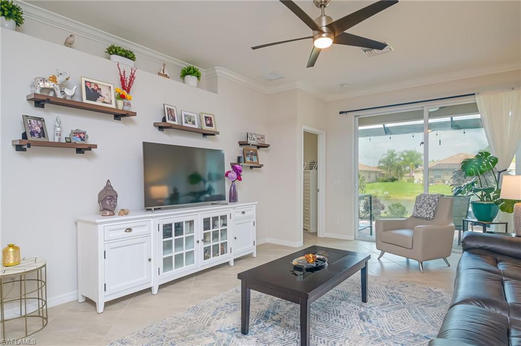 1803 Alameda Drive Naples, FL 34120 - Photo 4 of 30 a living room with furniture and a flat screen tv