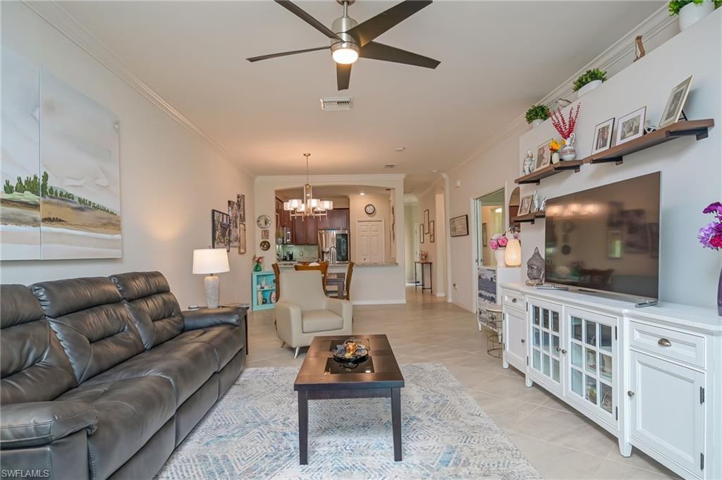 1803 Alameda Drive Naples, FL 34120 - Photo 5 of 30 a living room with furniture and a flat screen tv