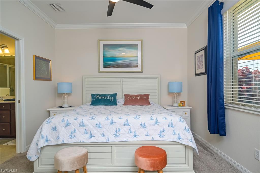 1803 Alameda Drive Naples, FL 34120 - Photo 10 of 30 a bedroom with a bed and a fireplace