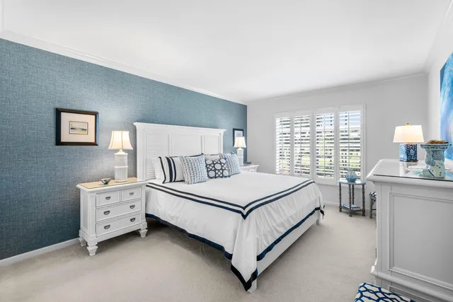 a bed room with a bed and a window