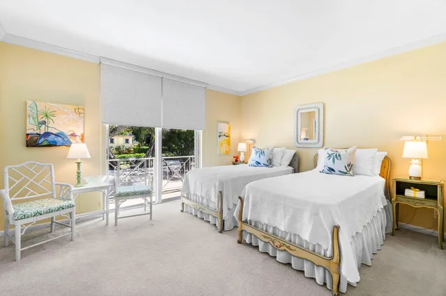 a bed room with a bed and a chair