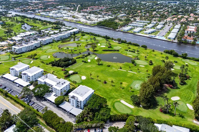 an aerial view of a house with a swimming pool yard and outdoor seating