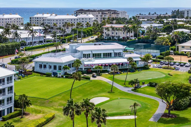 a view of a balcony with floor to ceiling windows with yard