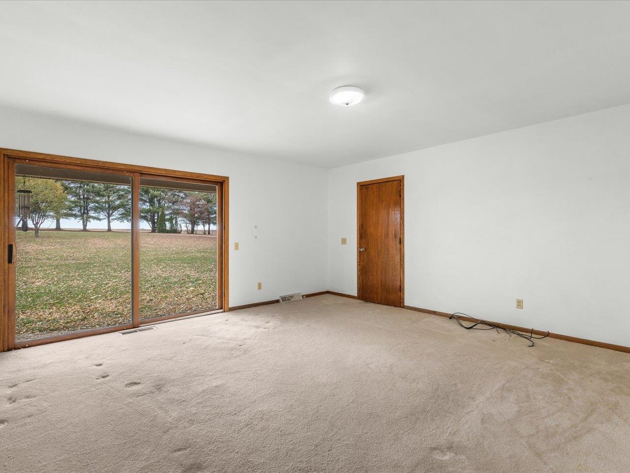 2110 East Angle Road Dakota, IL 61018 - Photo 20 of 47 an empty room with an outdoor view