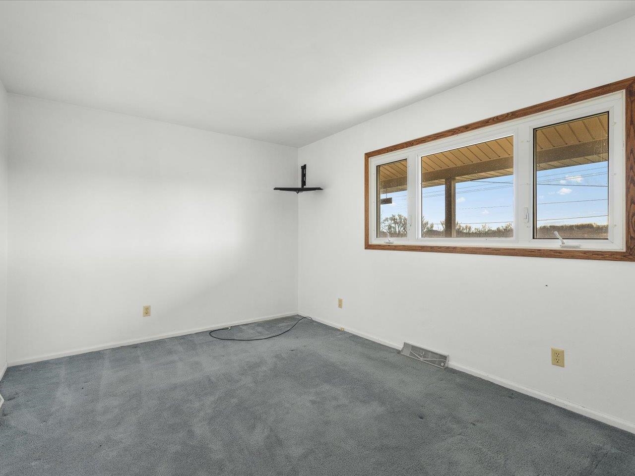 2110 East Angle Road Dakota, IL 61018 - Photo 22 of 47 an empty room with a window