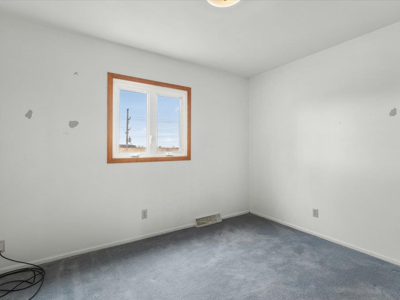 2110 East Angle Road Dakota, IL 61018 - Photo 28 of 47 an empty room with a window